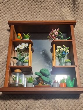 Wooden Mirrored Wall Shelf with Decorative Green and Brown Accents